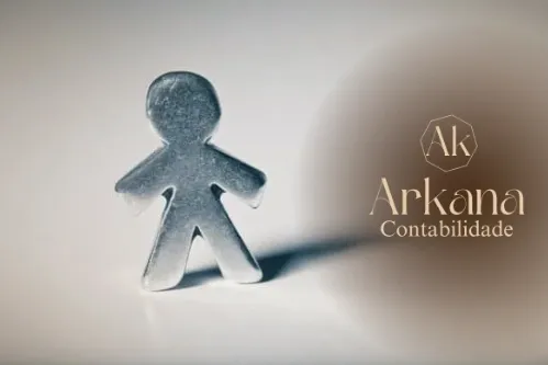 person-writing-to-paper-holding-a-calculator